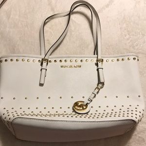 white and gold mk pocket book